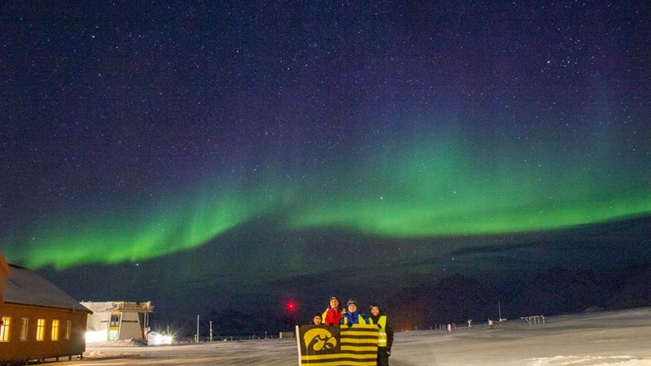 University of Iowa Students and faculty taking in the northern lights after watching the ICI-5 Sounding Rocket Launch